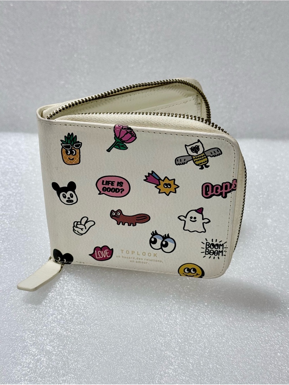 Toplook cream zip-around small wallet featuring an all-over sticker doodle print